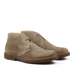 A pair of Stone Beige Suede Greenflex Desert Boots by Astorflex, featuring a minimalist lace-up design and brown crepe soles.