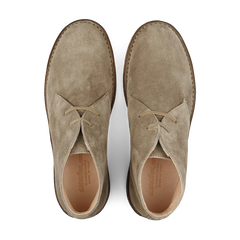 Top view of a pair of Stone Beige Suede Greenflex Desert Boots by Astorflex, featuring tan leather lining and crepe rubber soles.