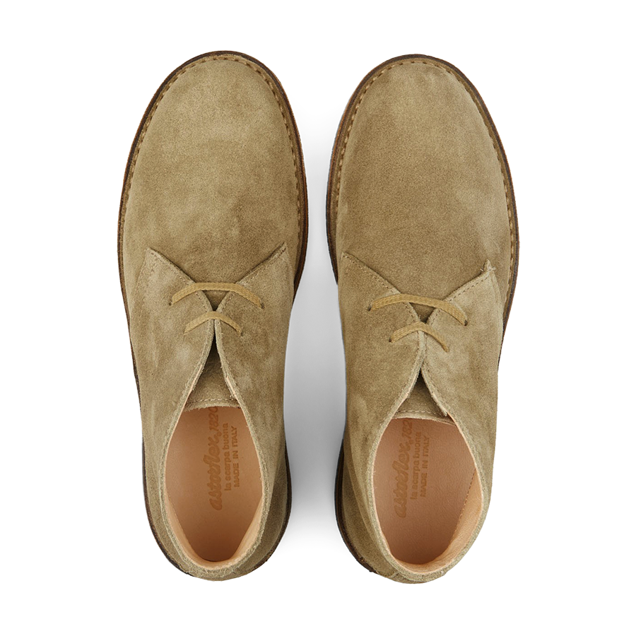 A pair of stone beige vegetable-tanned suede Astorflex Greenflex desert boots with laces, viewed from above.