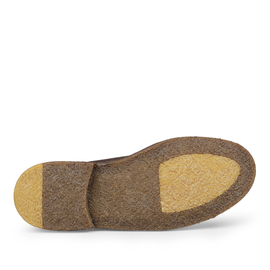 The image displays the bottom of the Testa di Moro Suede Leather Montflex Boots by Astorflex, highlighting a textured brown Montflex sole with lighter beige sections at the heel and ball.