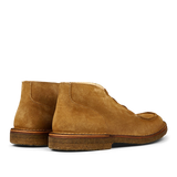 A pair of Whiskey Beige Suede Astorflex Chukka boots with visible stitching and rubber soles.