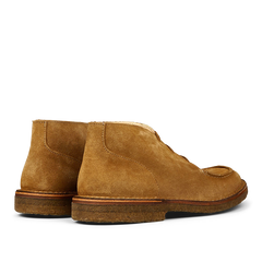 A pair of Whiskey Beige Suede Astorflex Chukka boots with visible stitching and rubber soles.