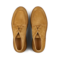 Top view of a pair of Astorflex Whiskey Beige Suede Dukeflex Chukka Boots, made from vegetable-tanned suede with visible stitching details, on a white background.