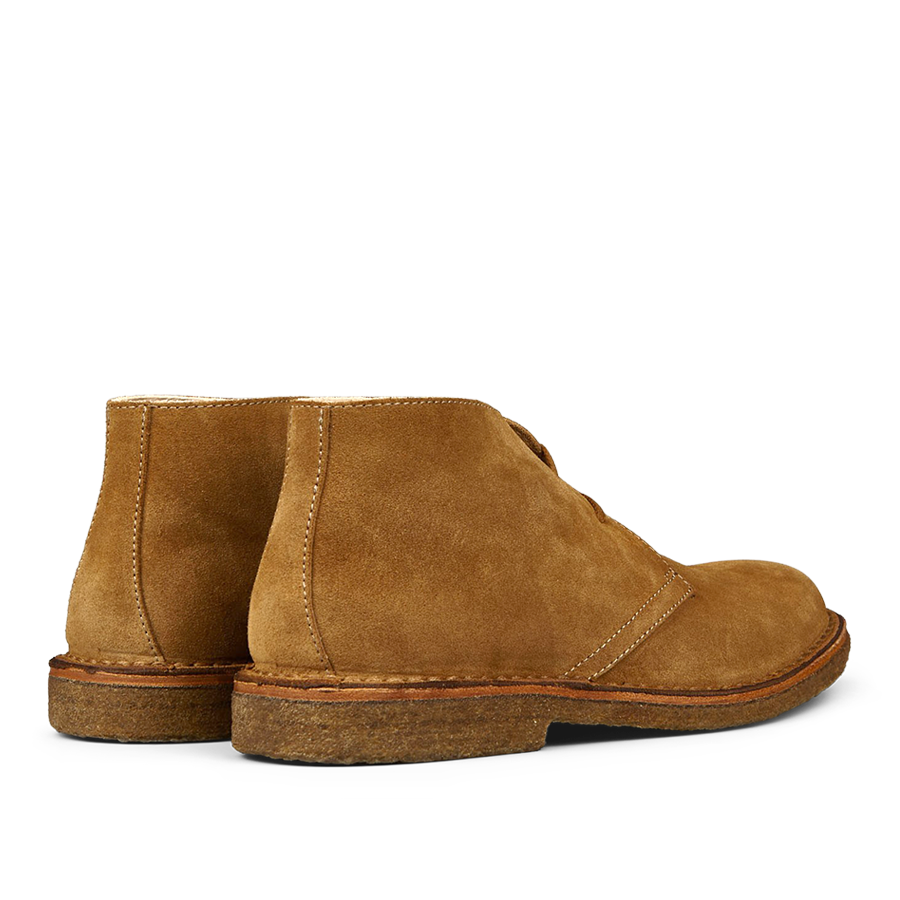 A pair of Whiskey Beige Suede Greenflex desert boots made from vegetable-tanned suede, viewed from a side angle by Astorflex.