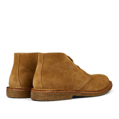 A pair of Whiskey Beige Suede Greenflex desert boots made from vegetable-tanned suede, viewed from a side angle by Astorflex.