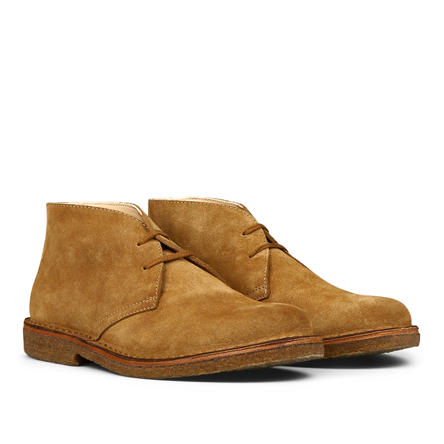 A pair of whiskey beige suede Greenflex desert boots by Astorflex on a plain background.