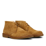 A pair of whiskey beige suede Greenflex desert boots by Astorflex on a plain background.