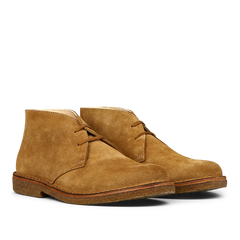 A pair of whiskey beige suede Greenflex desert boots by Astorflex on a plain background.