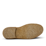 A single brown cork shoe insole for a Astorflex Whiskey Beige Suede Greenflex Desert Boot isolated on a transparent background.