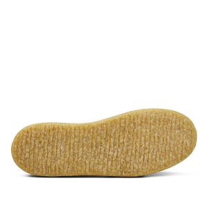 A single yellow rice crispy snack bar isolated on a white Astorflex Tenniflex Sneakers background.