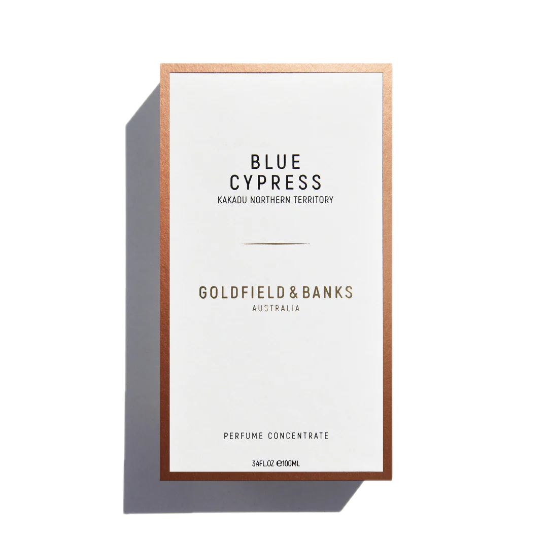 A white and gold box for Goldfield & Banks Blue Cypress 100ml Eau de Parfum, featuring a woody base infused with aromatic spices.