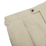 A close up of Beige Melange Wool Linen Pleated Trousers made by Baltzar Sartorial.