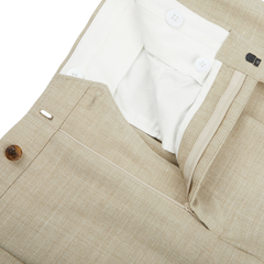 A close up of Baltzar Sartorial Beige Melange Wool Linen Pleated Trousers.