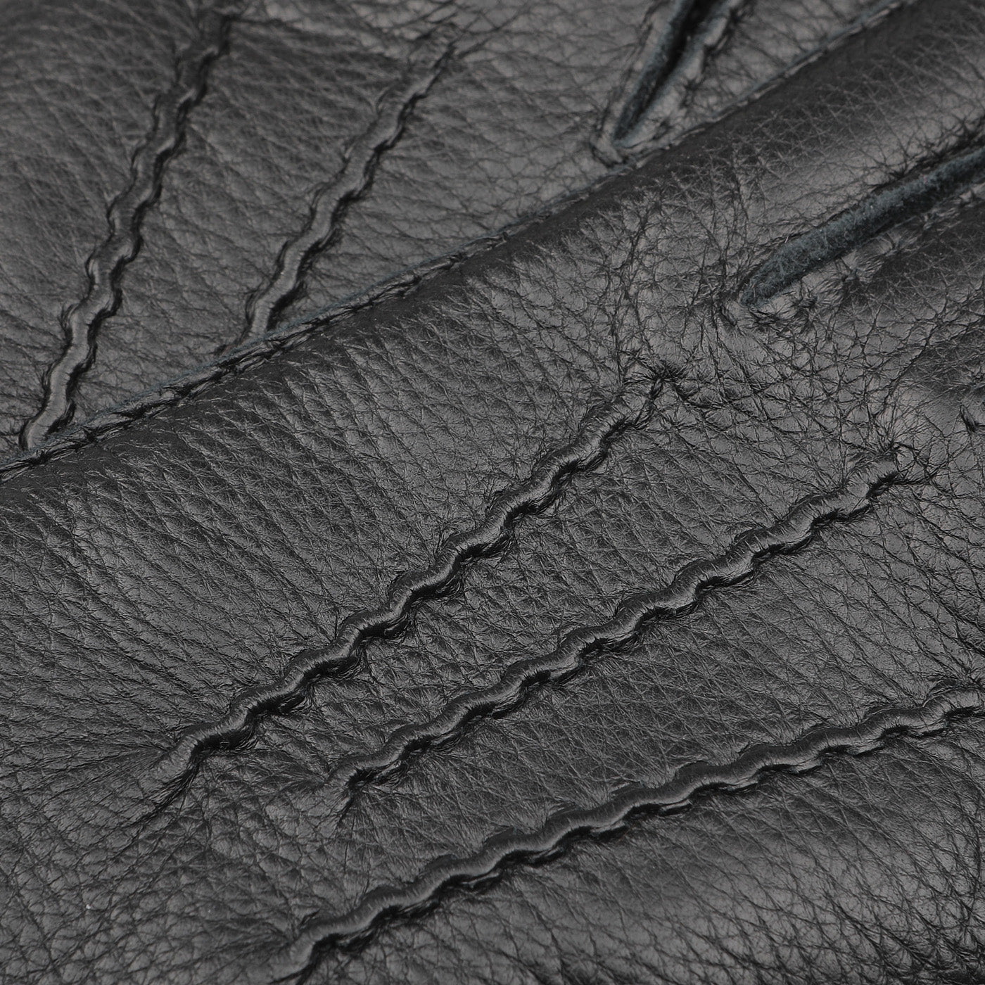 Close-up of the Black Cashmere Lined Elk Gloves by Baltzar Sartorial, featuring stitched seam details and crafted by master glove makers.