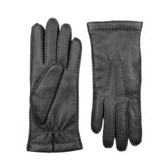 A pair of expertly designed Black Cashmere Lined Elk Gloves from Baltzar Sartorial showcases one glove lying flat and the other facing down, highlighting the intricate stitch patterns. These elk leather gloves feature textured detailing, underscoring the craftsmanship of their master glove makers.