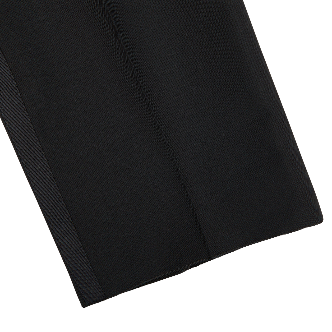 Close-up of a black fabric swatch on a white background, showing texture and a subtle seam along the edge, reminiscent of the luxurious weave found in Baltzar Sartorial Black Wool Mohair Tuxedo Flat Front Trousers.