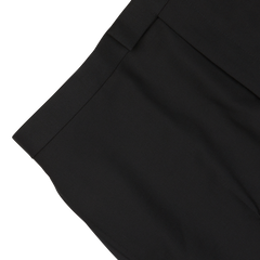 Close-up image of Black Wool Mohair Tuxedo Flat Front Trousers by Baltzar Sartorial, showing the waistband and upper portion of these formal look pants, made from a luxurious wool-mohair blend.