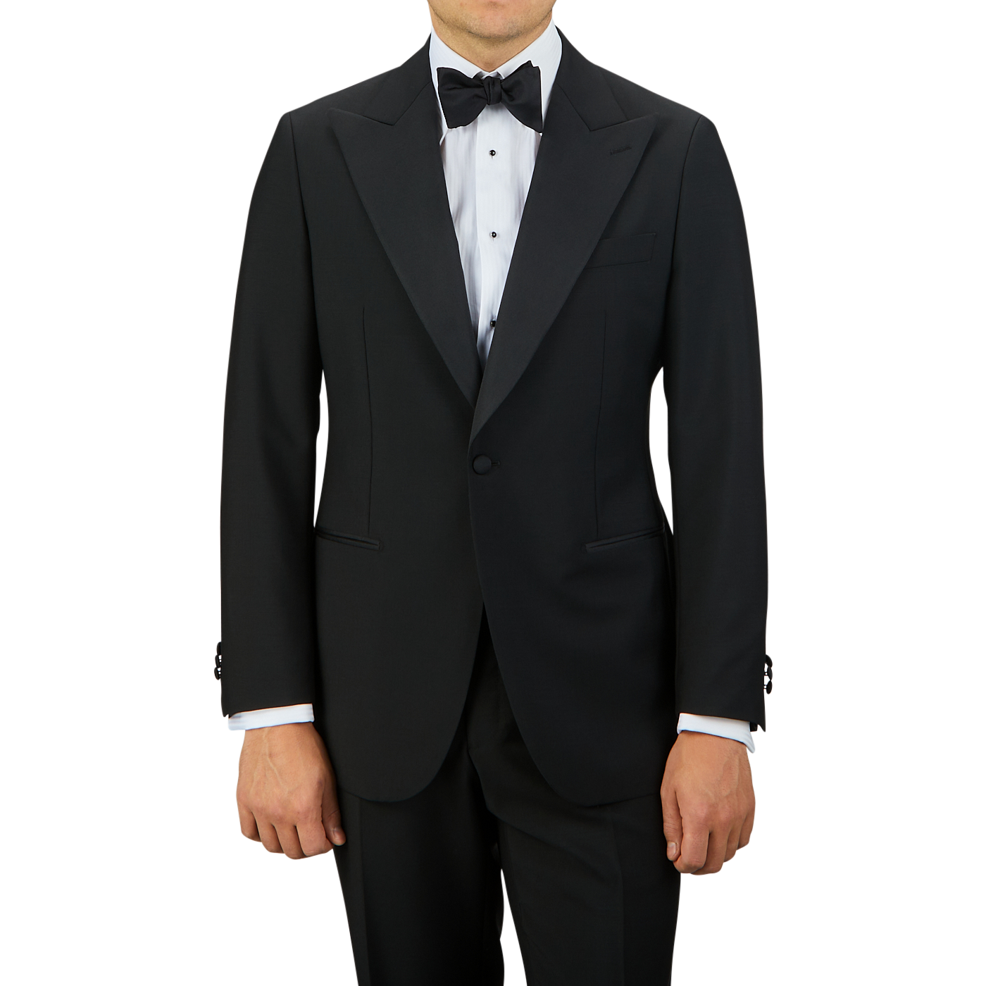 A man in a sleek Baltzar Sartorial Black Wool Mohair Tuxedo Jacket with a white dress shirt and a black bow tie stands against a plain background. His face is not shown, highlighting the sophistication of his eveningwear ensemble.