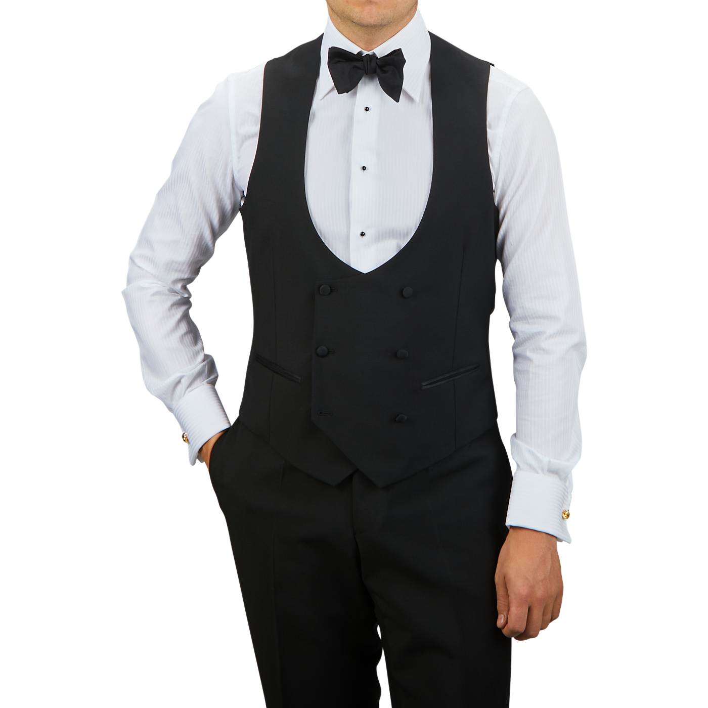 A person dressed in formal attire features a Black Wool Mohair Tuxedo Waistcoat by Baltzar Sartorial with a white dress shirt and black trousers, complemented by a stylish bow tie.