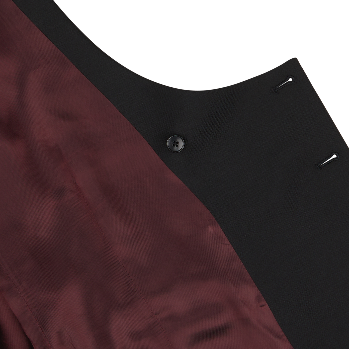 Close-up view of the lining and button detail of a **Baltzar Sartorial Black Wool Mohair Tuxedo Waistcoat**, showcasing the seam where the maroon and wool-mohair blend fabrics meet.