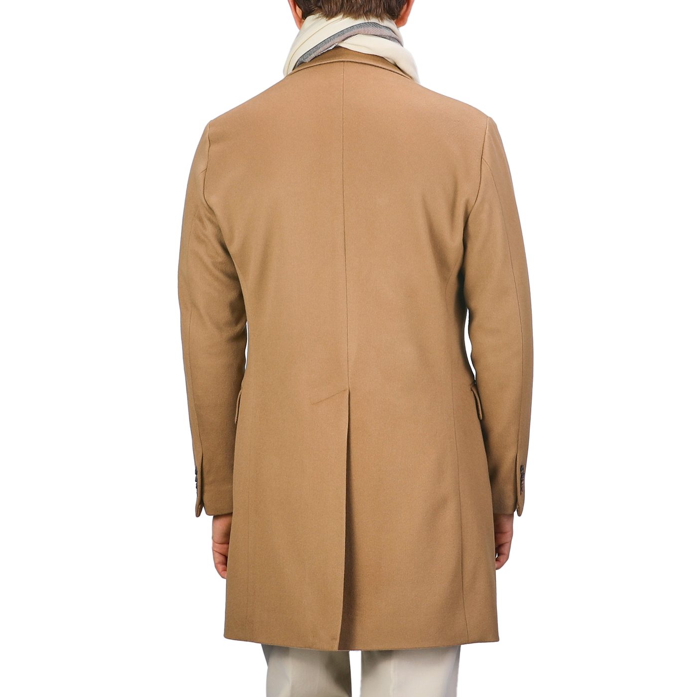 A person clad in a Camel Beige Loro Piana Wool Tailored Coat from Baltzar Sartorial, accompanied by a light scarf, viewed from behind.