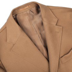 Close-up of the Camel Beige Loro Piana Wool Tailored Coat by Baltzar Sartorial, showcasing its notch lapel and smooth lining.