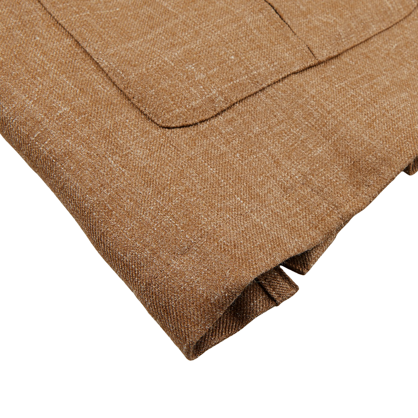 A close-up of a folded Baltzar Sartorial Camel Brown Wool Silk Linen Safari Jacket, showcasing a pocket detail, is set against a gray surface.