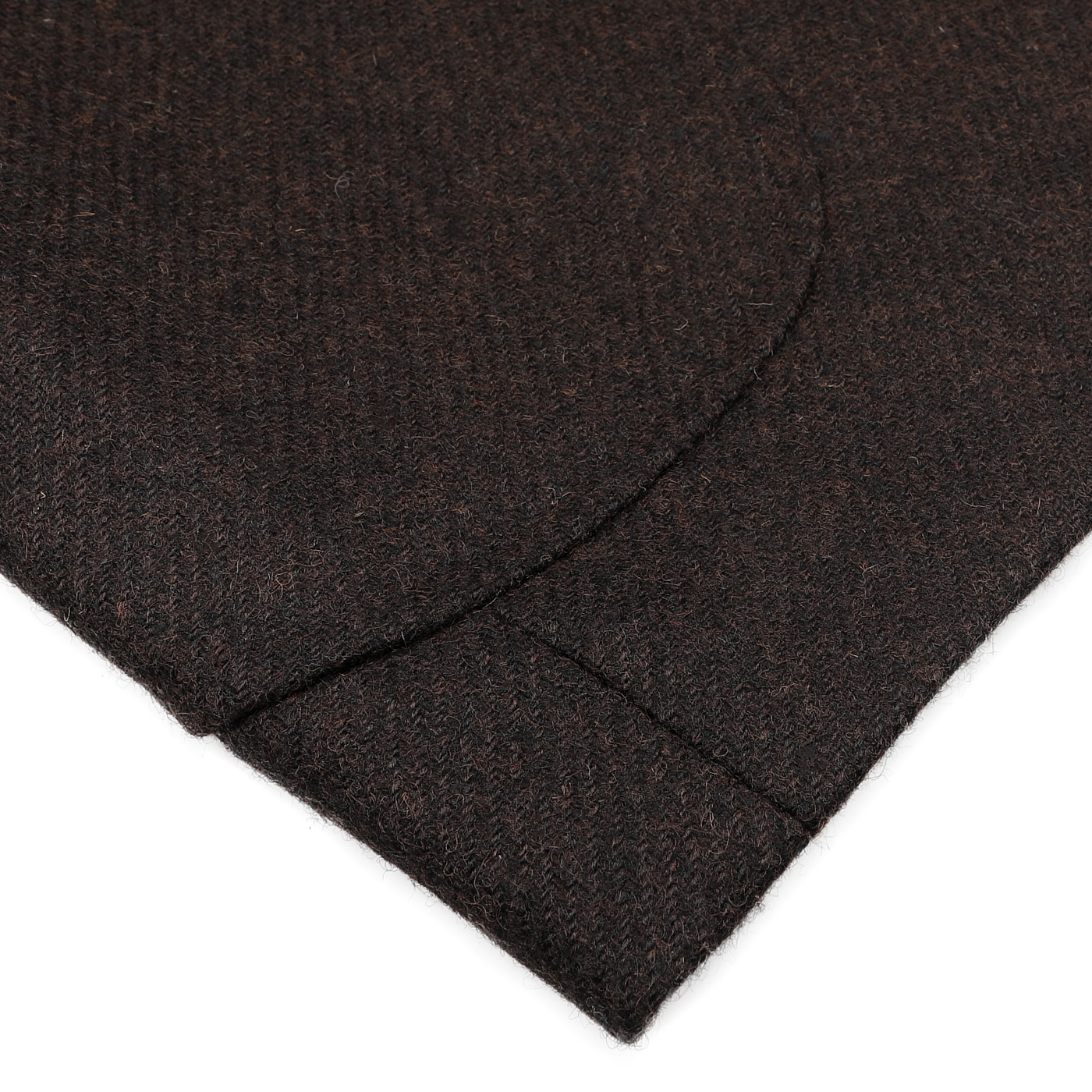 Close-up of the Dark Brown Wool Tweed Blazer by Baltzar Sartorial, crafted from pure wool tweed and featuring a curved seam detail that enhances its sophisticated design.