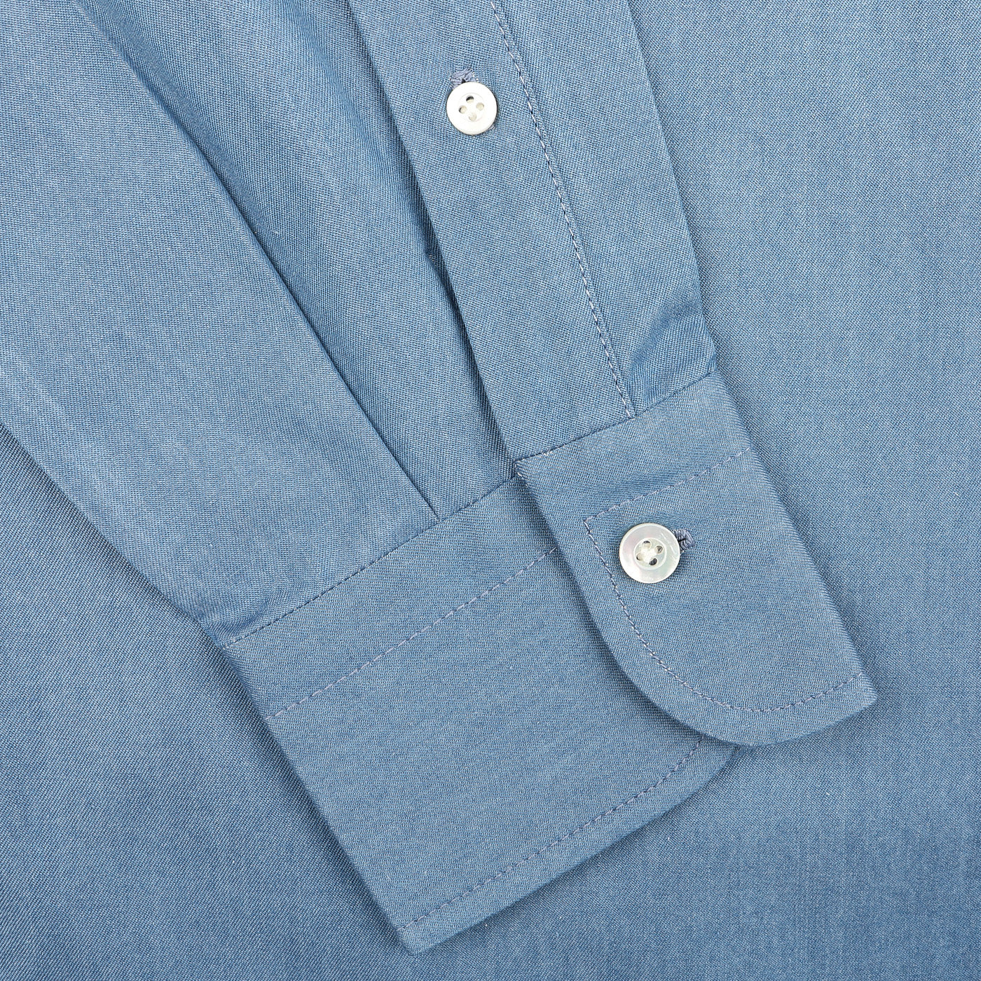 Close-up of the Denim Blue Cotton Twill BD Western Shirt by Baltzar Sartorial, highlighting its white buttons on pure cotton twill fabric.