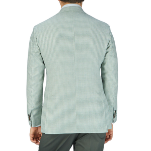 The back view of a man wearing a half-canvas constructed Green Houndstooth Wool Silk Linen Blazer from Baltzar Sartorial.