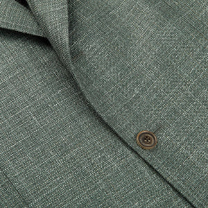 A close up of a Green Melange Wool Silk Linen Blazer with notch lapel by Baltzar Sartorial.