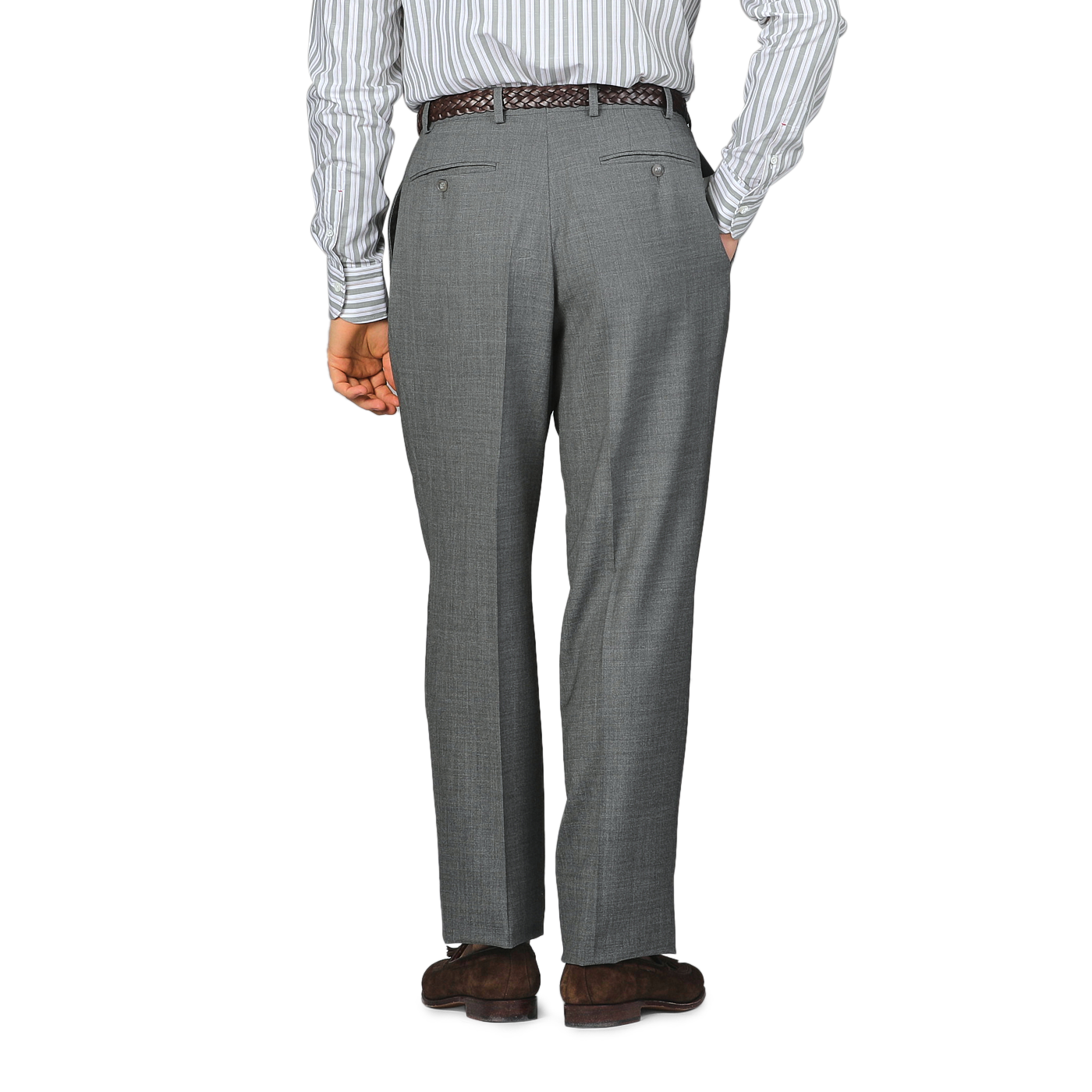 Dressed in a striped shirt and Baltzar Sartorial's Grey High-Twist Wool Pleated Trousers, a person stands with their back to the camera, exuding understated elegance.