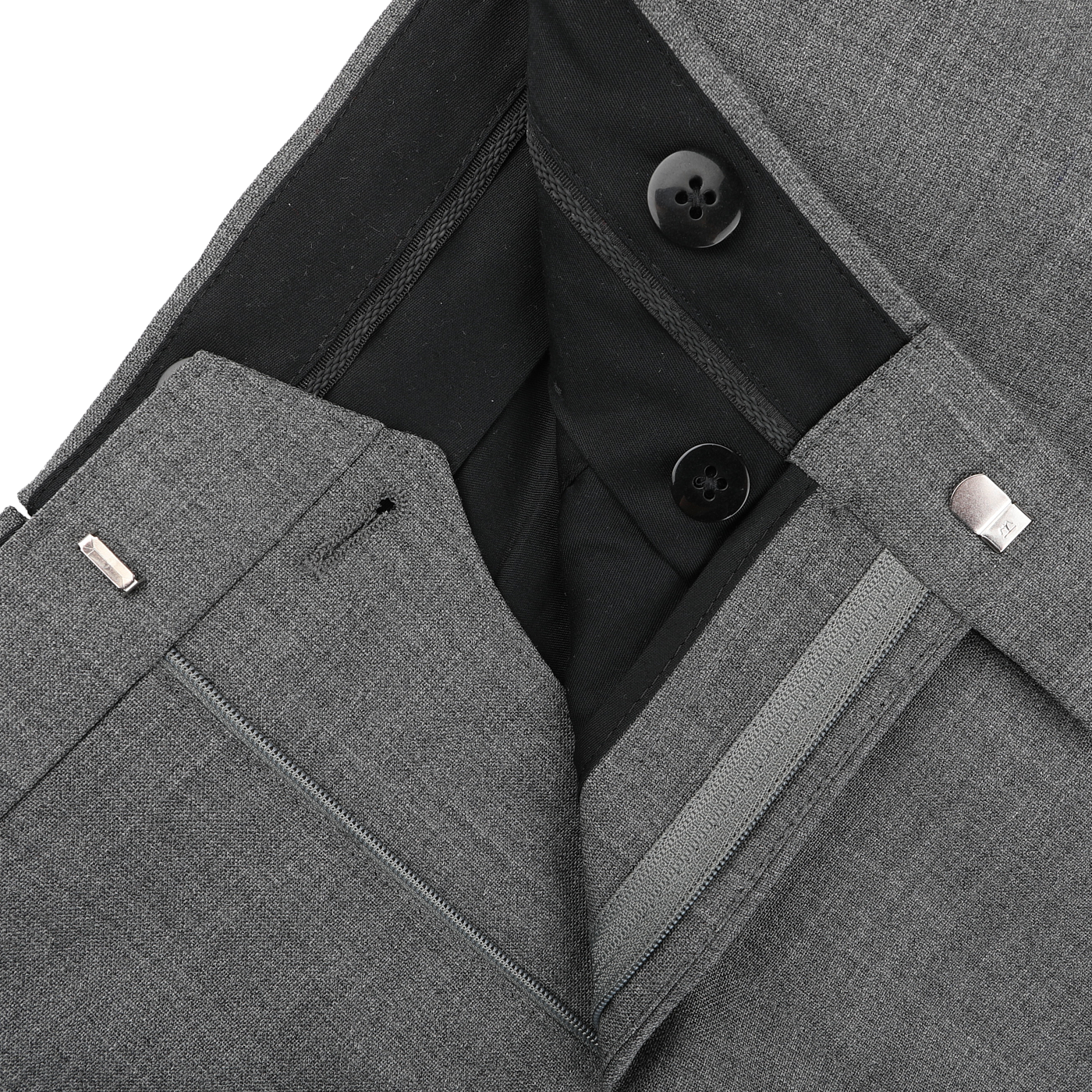 Close-up of Baltzar Sartorial Grey High-Twist Wool Pleated Trousers highlighting the tailored fit's waistband, black lining, buttons, and zipper.