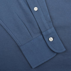 Close-up of an Indigo Blue Cotton Piqué BD Popover Shirt by Baltzar Sartorial, featuring white buttons and highlighting the cuff and partial sleeve.