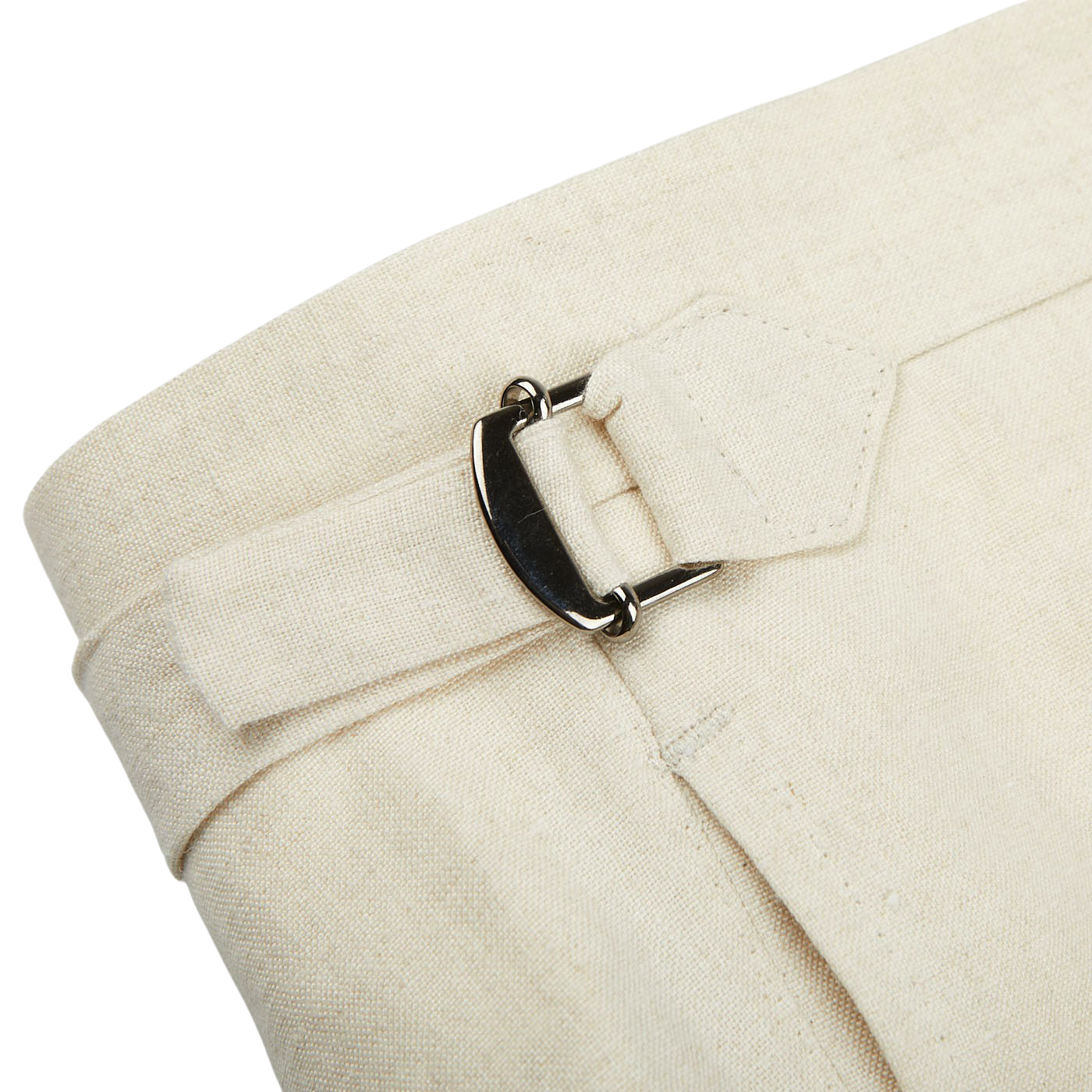 A close-up of a pair of Light Beige Pure Linen Pleated Trousers by Baltzar Sartorial with a buckle.