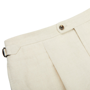 A close up of the Light Beige Pure Linen Pleated Trousers, a Baltzar Sartorial in-house brand.