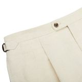 A close up of the Light Beige Pure Linen Pleated Trousers, a Baltzar Sartorial in-house brand.