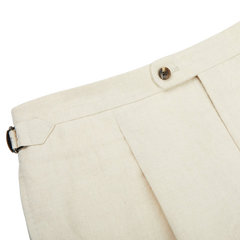 A close up of the Light Beige Pure Linen Pleated Trousers, a Baltzar Sartorial in-house brand.