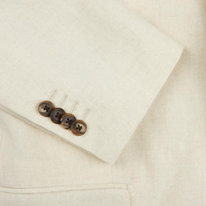 A close up of a Light Beige Pure Linen Suit Jacket with brown buttons, from Baltzar Sartorial.