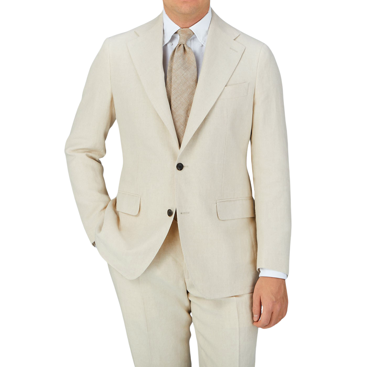 A man is posing in a Light Beige Pure Linen Suit Jacket by Baltzar Sartorial, consisting of a suit jacket and tailored trousers.