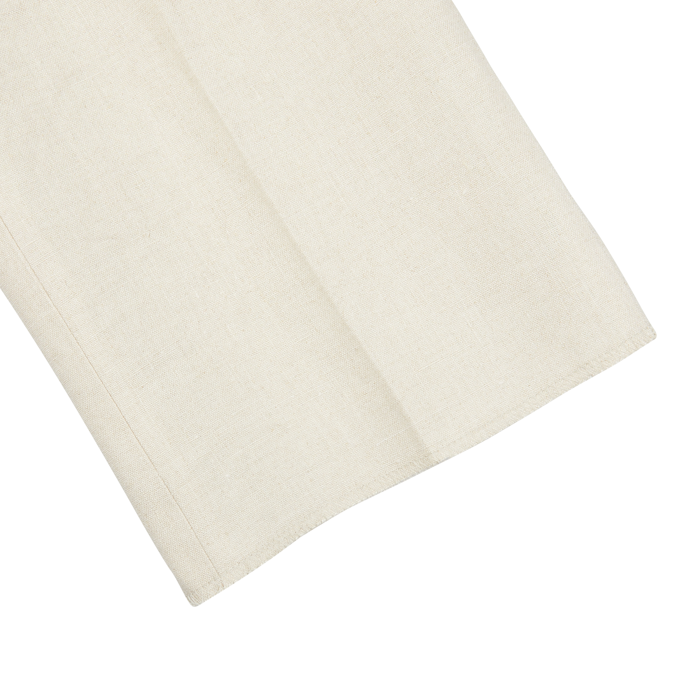 A light beige pure linen napkin on a flat surface. (Brand Name: Baltzar Sartorial)