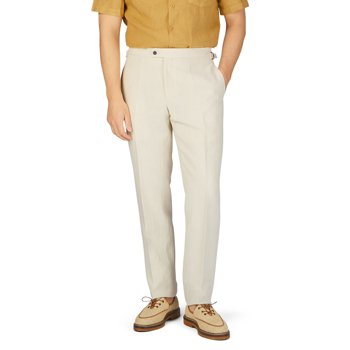 A man in Baltzar Sartorial Light Beige Pure Linen Flat Front Trousers.