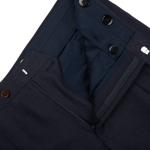 A close up of the pocket of Baltzar Sartorial's Navy Blue Pure Linen Pleated Trousers.