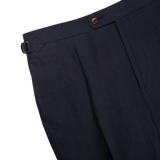 Description: A close up of Baltzar Sartorial's Navy Blue Pure Linen Pleated Trousers with a tailored fit.