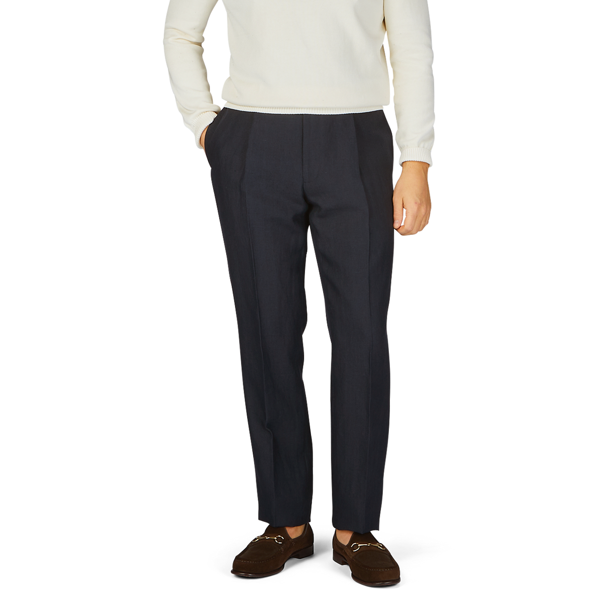 A man in a white sweater and Baltzar Sartorial Navy Blue Pure Linen Pleated Trousers.