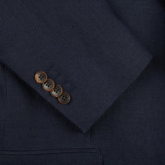 A close up of a Baltzar Sartorial Navy Blue Pure Linen Suit Jacket with buttons.