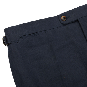 A close up view of Baltzar Sartorial navy blue pure linen flat front trousers.