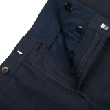 A close up of the pocket of Baltzar Sartorial's Navy Blue Pure Linen Flat Front Trousers.