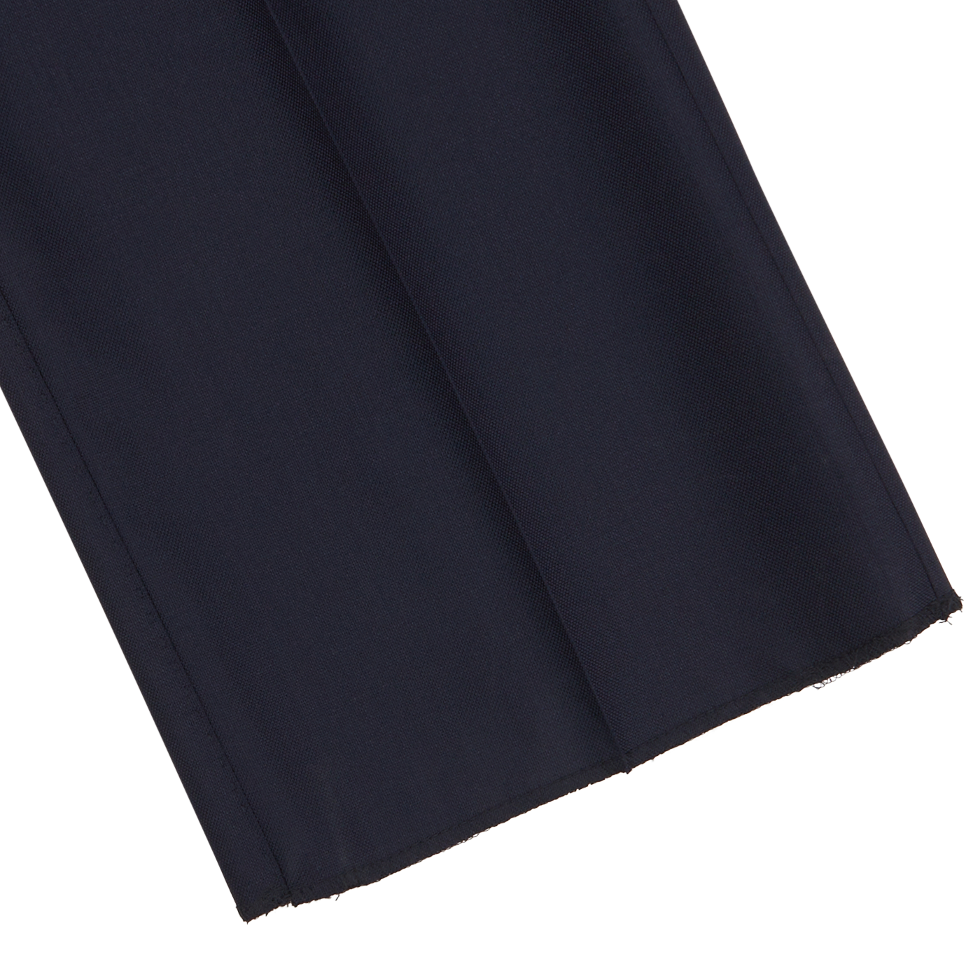 Close-up of Baltzar Sartorial Navy Super 100's Wool Pleated Suit Trousers fabric with a visible weave, highlighting the hem and unfinished edge against a white background.