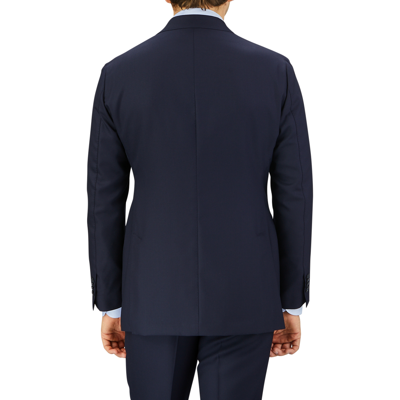 Rear view of a man wearing a Baltzar Sartorial Navy Super 100's Wool Suit Jacket and matching pants, against a grey background.